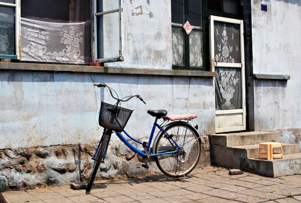 stock image Bike and old house