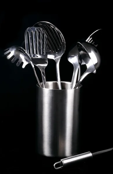 stock image Kitchen utensiles on black