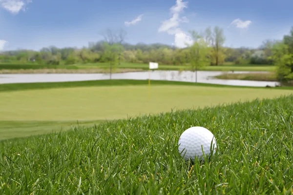 Golf ball on the ground — Stock Photo, Image