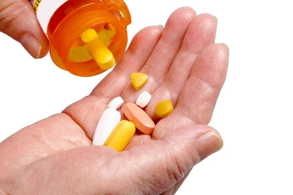 Senior hands and pills — Stock Photo, Image