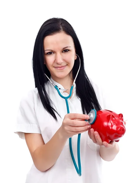 Verpleegster met piggy bank — Stockfoto