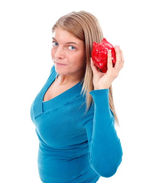 Frau hält Sparschwein — Stockfoto