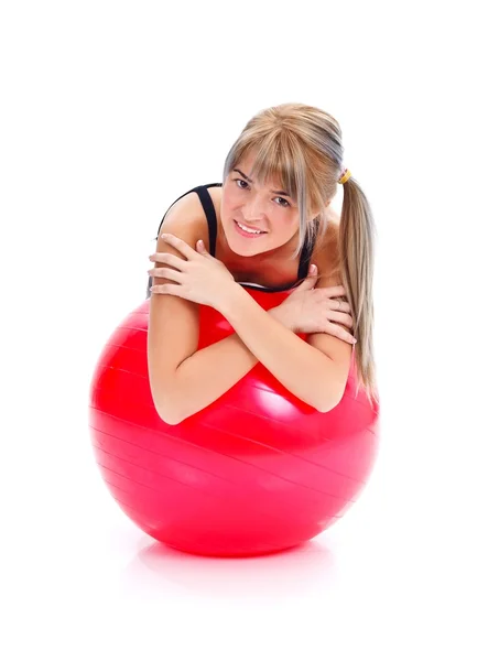 Girl leaning on exercise ball — Stock Photo, Image