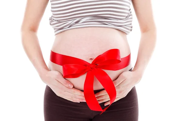 Schwangerer Bauch mit Schleife — Stockfoto