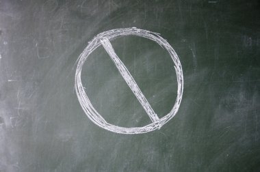 Stop sign drawn with chalk on blackboard clipart