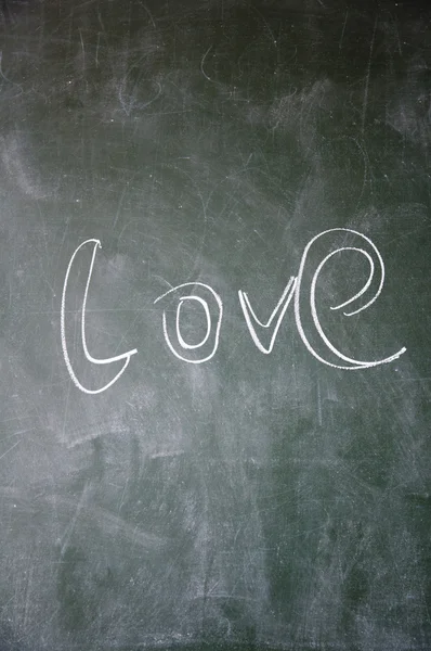 Love title written with chalk on blackboard — Stock Photo, Image