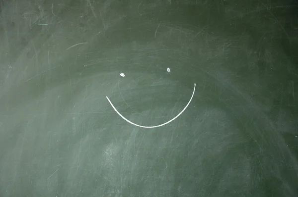 Smile drawn with chalk on blackboard — Stock Photo, Image
