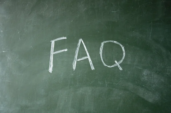 FAQ title written with chalk on blackboard — Stock Photo, Image