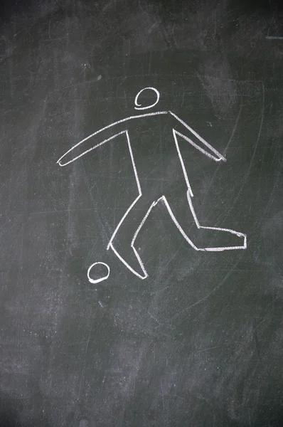 Joueur de football dessiné à la craie sur tableau noir — Photo