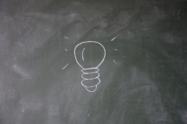 Bulb drawn with chalk on blackboard — Stock Photo, Image
