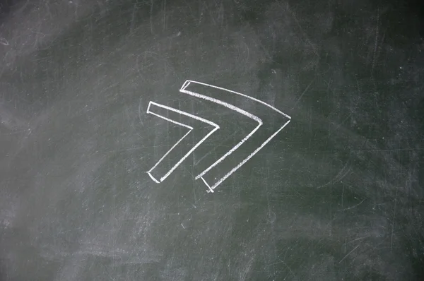 Arrows drawn with chalk on blackboard — Stock Photo, Image