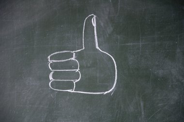 Thumb drawn with chalk on blackboard clipart