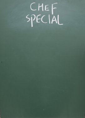 Chef special title written with chalk on blackboard clipart