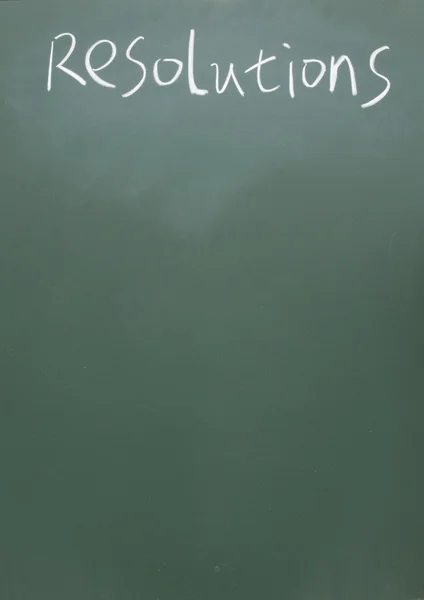 Resolutions title written with chalk on blackboard — Stock Photo, Image
