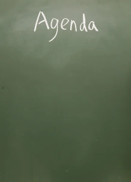 Agenda title written with chalk on blackboard — Stock Photo, Image
