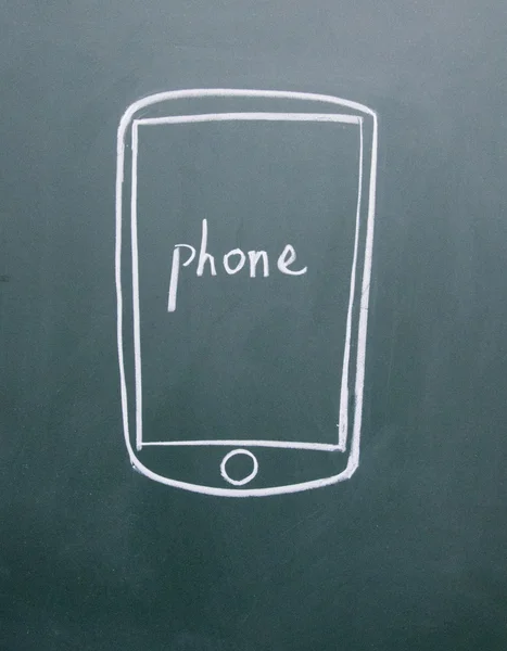 Телефон с мелом на доске — стоковое фото
