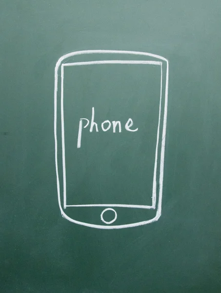 Телефон с мелом на доске — стоковое фото