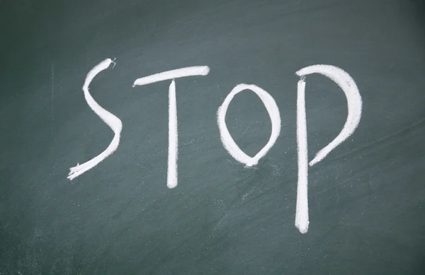 Stop sign drawn with chalk on blackboard — Stock Photo, Image