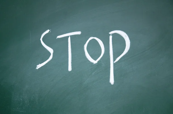 Stop sign drawn with chalk on blackboard — Stock Photo, Image