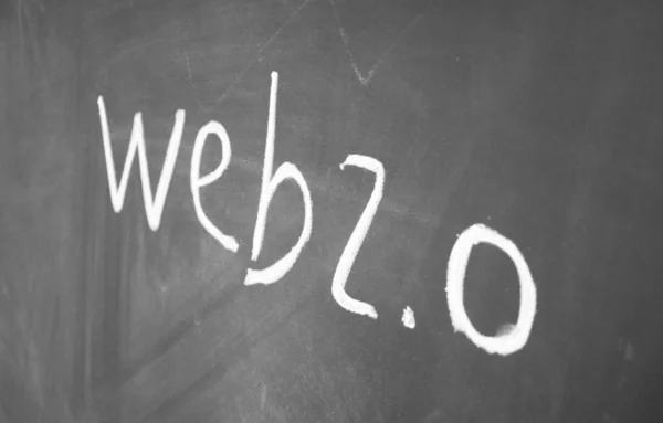 Stock image Web 2.0 title written with chalk on blackboard