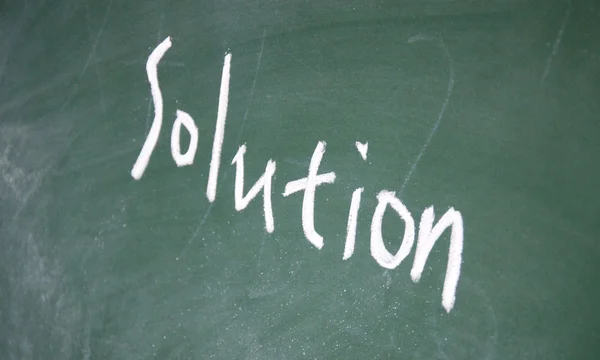 Solution title written with chalk on blackboard — Stock Photo, Image