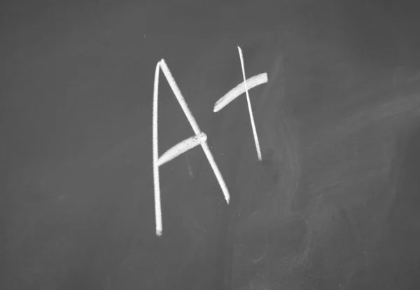 A + Zeichen mit Kreide auf Tafel geschrieben — Stockfoto