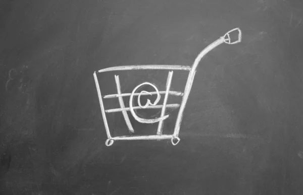 Online Shopping cart symbol drawn with chalk on blackboard — Stock Photo, Image