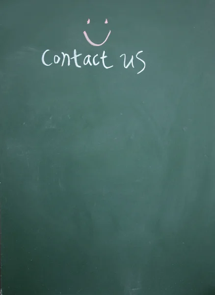 Contact us title drawn with chalk on blackboard — Stock Photo, Image
