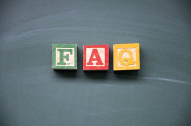 FAQ title written with chalk on blackboard clipart