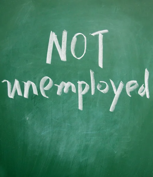 Not unemployed title written with chalk on blackboard — Stock Photo, Image