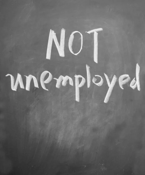 Not unemployed title written with chalk on blackboard — Stock Photo, Image