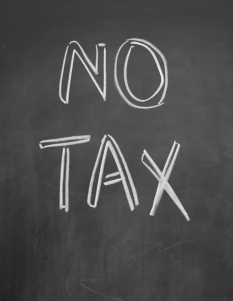 No tax title written with chalk on blackboard — Stock Photo, Image