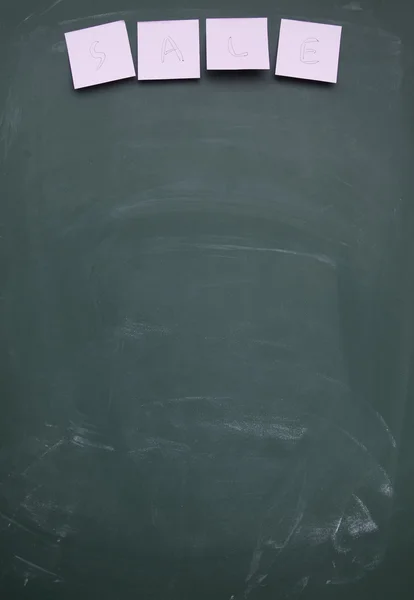 Sale title written with chalk on blackboard — Stock Photo, Image