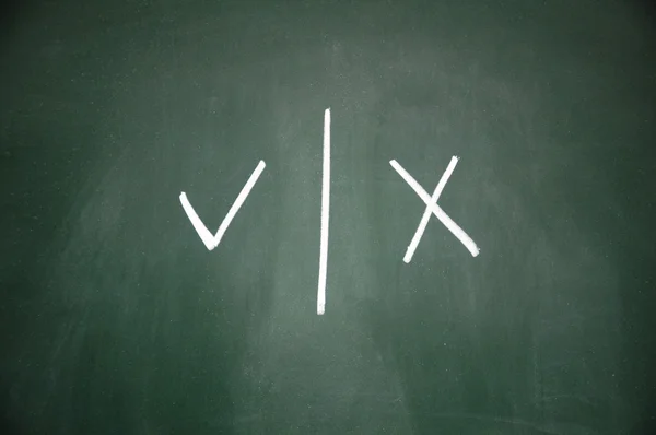 Right and wrong symbol written with chalk on blackboard — Stock Photo, Image
