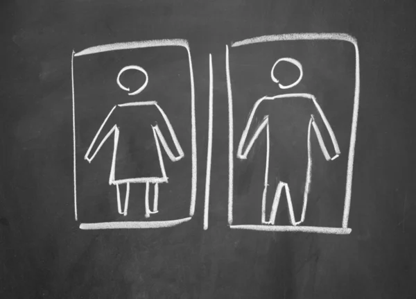 黒板にチョークで描かれた女性と男性の記号 — ストック写真