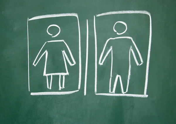 Vrouwen en mannen teken getekend met krijt op blackboard — Stockfoto