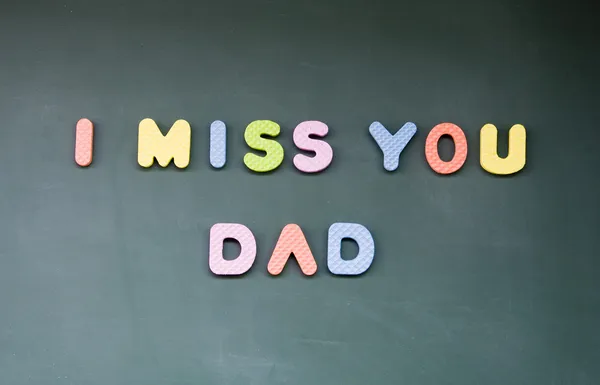 stock image I miss you dad sign drawn with chalk on blackboard