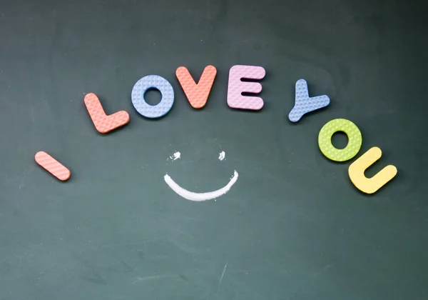 I love you sign drawed with chalk on board — стоковое фото