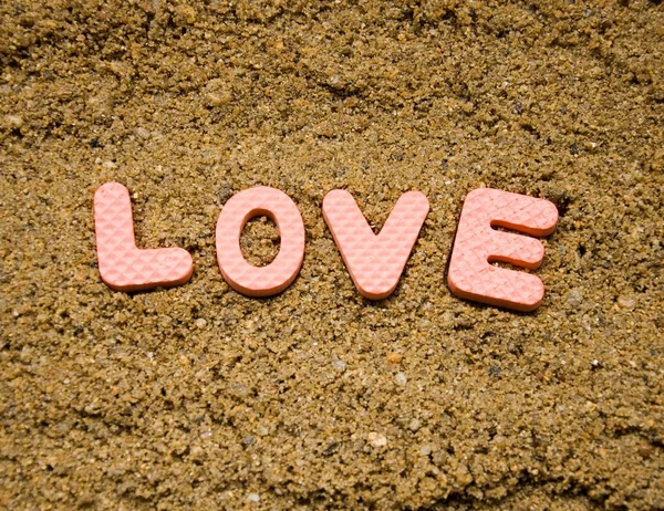 Sfondo segno di amore e sabbia — Foto Stock