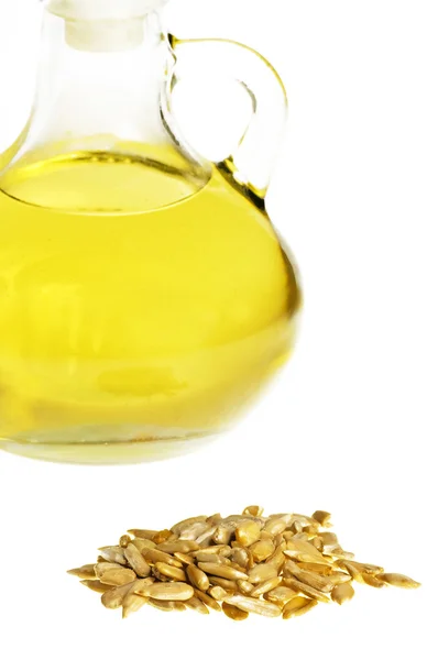 Подсолнечное масло и семена подсолнечника — стоковое фото