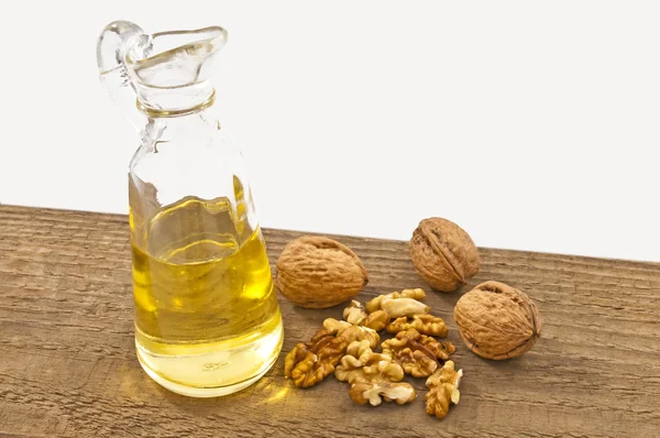 Walnut oil with walnuts — Stock Photo, Image