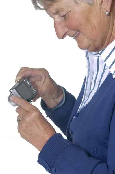 Pensioner with modern camera — Stock Photo, Image