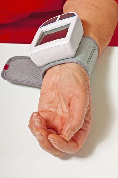 stock image Pensioner is measuring her blood pressure