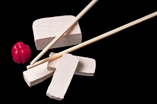 stock image Tofu with chop-sticks