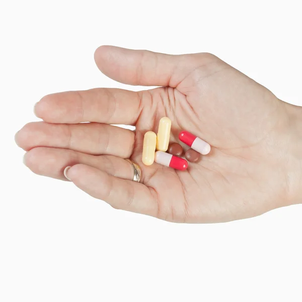 Tabletták a kezében — Stock Fotó