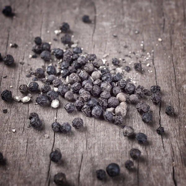 Freshly dried peppercorn on wooden table — Stock Photo, Image