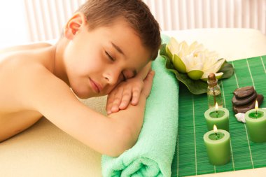 Boy rests with spa clipart