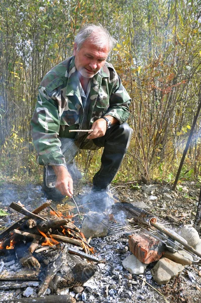 stock image Fisherman by the fire