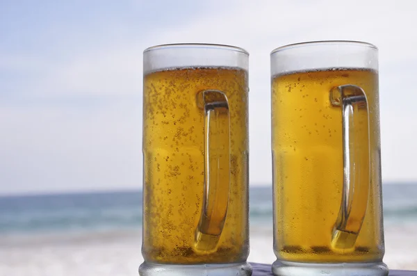 stock image Chilled beer on a sunny day at the beach