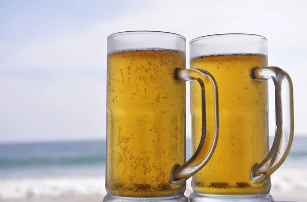 stock image Chilled beer on a sunny day at the beach